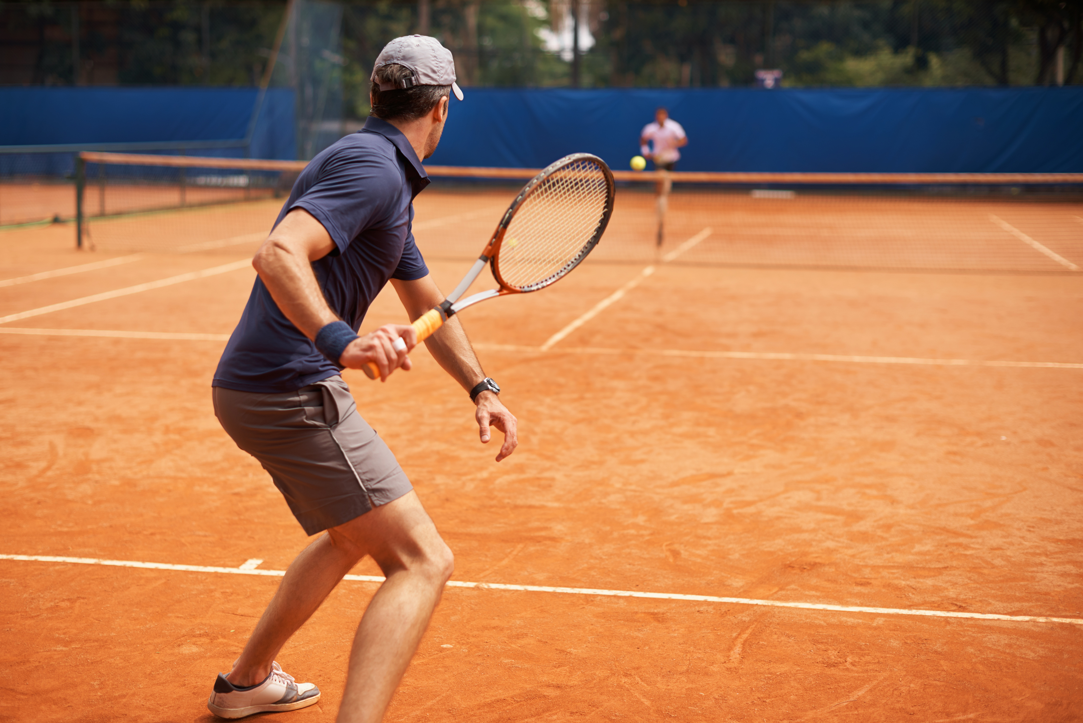 Two male tennis players on court at Topserve Tennis